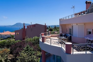 General sight of Master bedroom"s balcony with its furniture and the amazing view of sea and Nature view.