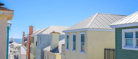 The master suite on the home's third floor affords spectacular views of the colorful boardwalk homes and the sea!