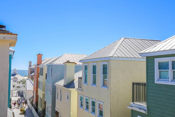 The master suite on the home's third floor affords spectacular views of the colorful boardwalk homes and the sea!