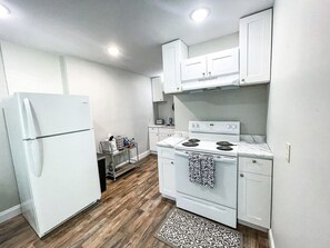 Kitchen with all utensils & fully stocked coffee bar