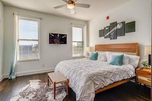 Primary Bedroom featuring a King bed with a Smart TV and spacious closet.