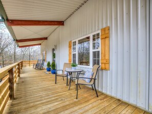 Rain or shine this covered porch is a great place to enjoy your favorite drink.