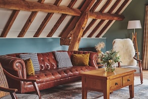 The Chesterfield sofa in the living room at Hay Bale Cottage, Worcestershire