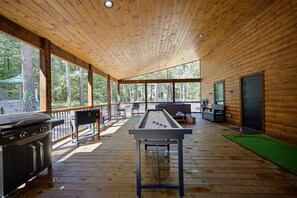 A massive back deck has been outfitted with shuffleboard, dining, putting green, corn hole, Blackstone griddle, and more! It's truly SO MUCH FAWN!
