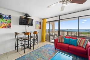 A seating area below the flat screen tv.