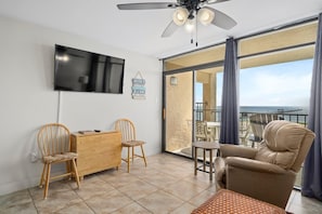 This spacious living room allows space for your family to spend time together comfortably. Enjoy the access to the patio right from the living area!
