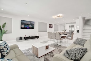 The home features a bright, open concept living with chic, contemporary design.