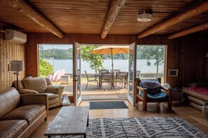 Great room opens onto an expansive, waterside deck