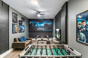 Harry Potter themed game room of the Home in Davenport Florida - Fun and relaxing game room that will surely give you a fantastic stay - Have fun with foosball table or paly table tennis - Smart TV and Netflix