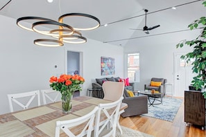 Cool "Hoopla" chandelier gives you plenty of light for dining upstairs.