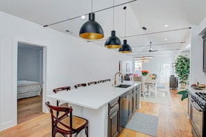 Upper level kitchen with expansive island.