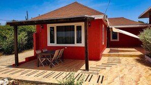 Front side with shaded patios and ocean view