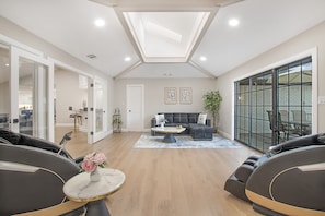 Relax in style with massage chairs, a skylit ceiling, and cozy patio views!