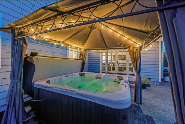 Hot tub with lit-up gazebo