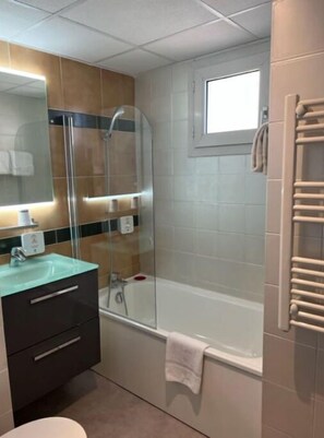 Freshen up in the bathroom after a day of adventure.