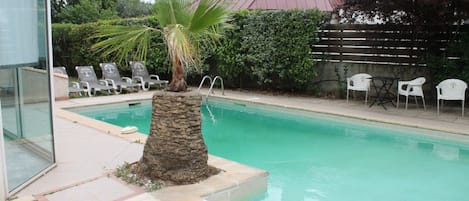 Lounge by the pool in the sunshine and take a dip in the outdoor pool.