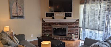 Living room with gas fireplace, streaming and cable TV, Wii