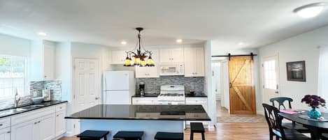 Main living space with kitchen, dining and living room