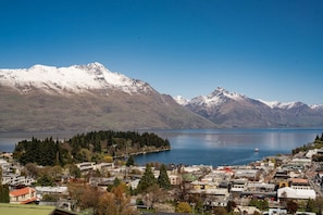 Snow capped mountains, lake and township