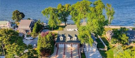 Aerial view of parking area and house. Looking north towards the lake.