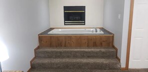 Relax with a warm bath by the fire.