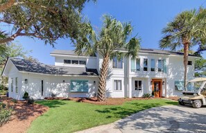 6 34th Avenue, Isle of Palms, South Carolina welcomes guests with an updated interior, a private pool and hot tub, and a short 2-minute walk to the beach!