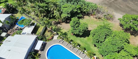 View of community pool and beach from the terrace