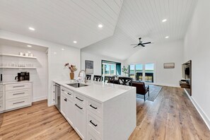 This living area is beyond words, ocean views from multiple windows.