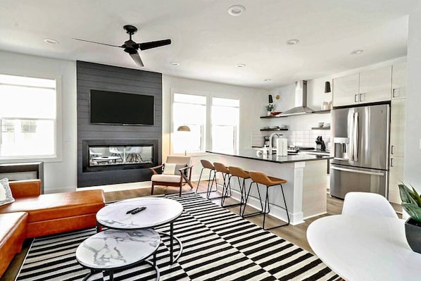 You'll love our open concept living, dining & kitchen with huge windows and natural light!