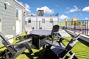 Private roof top deck with seating, cornhole, amazing views and ocean breeze!