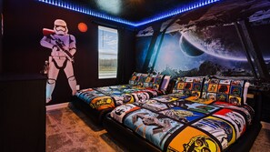 Kids will have fun in this Star Wars bedroom with beautiful lights.