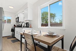 The fully equipped kitchen contains all of the items you’ll need to cook, bake, and enjoy a homecooked meal.