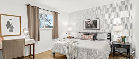 Spacious bedroom offers natural light, as well as black out curtains