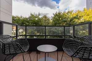 Balcony with garden furniture.