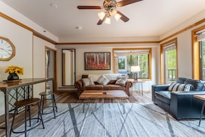 Living area featuring flat screen TV and cozy furnishings.