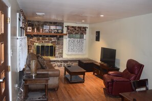 Livingroom with wood burning fireplace