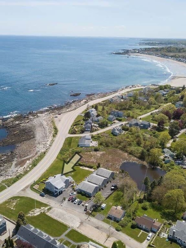 Aerial view of "Snug Harbor", across the street from the ocean, large lawn area to relax, sunbath, and walking distance to Wallis Sands