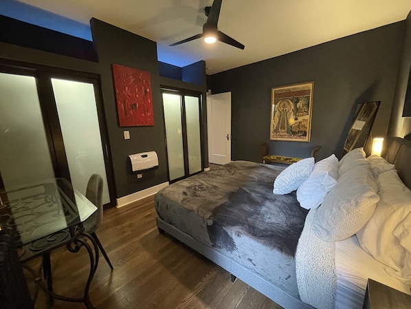 Main bedroom - king bed, nightstands, bench, ceiling fan, full length mirror