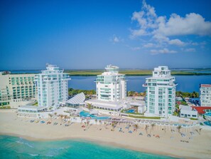 Aerial view of the resort, Oleo Cancun Playa.  Penthouse Combo #201 is located on the Penthouse level of the center tower, top floor, 7th.  Photo Order: Terraces, Main areas, bedrooms/bathrooms, resort photos, what’s nearby.