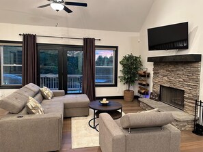 The living area has earthy tones and textures that create cozy vibes.