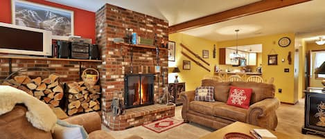 Cozy living room with wood burning fireplace