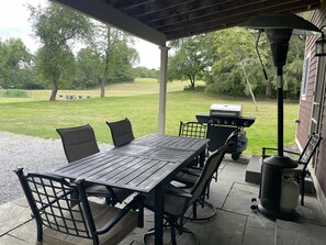 Covered patio overlooking large shared lawn