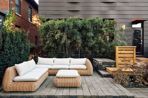 Dine, unwind, and soak in the seasons—this elegant outdoor seating offers the perfect spot to relax year-round.