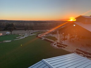 A stunning sunset photo from the wine members viewing tower overlooking the entire Resort Property, The Texas Hill Country in the Distance, and Pedernales River! You won't forget this stunning view during your sta
