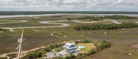 Marsh Madness - a SkyRun Kiawah Property - Aerial view of home and dock