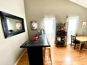 Small kitchen w/ 3 burners & everything you need to cook small meals. No oven