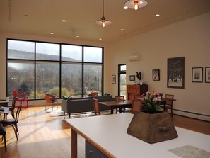 Great room w/ floor to ceiling windows