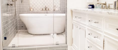 Master bath oversized wet room including steam, dual shower, freestanding tub