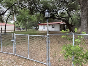 Drive through gate will be open and if dark, the lights will be on for you.