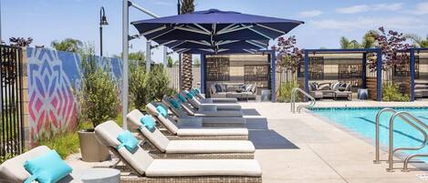 Relax at the pool in a lounge chair or cabana!